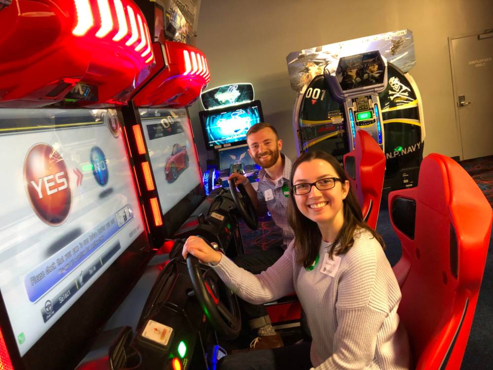 Two people playing arcade games